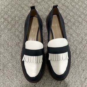 Navy and white leather loafers.